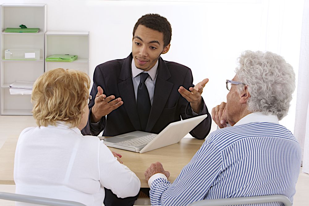 A salesperson is talking to his customers