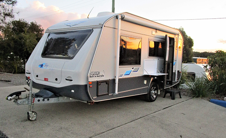 A Jurgens caravan is being parked in the yard