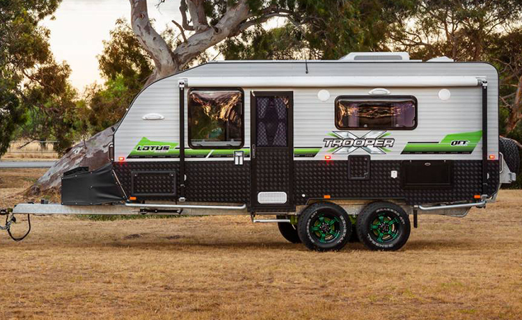 A Lotus Trooper caravan is being parked