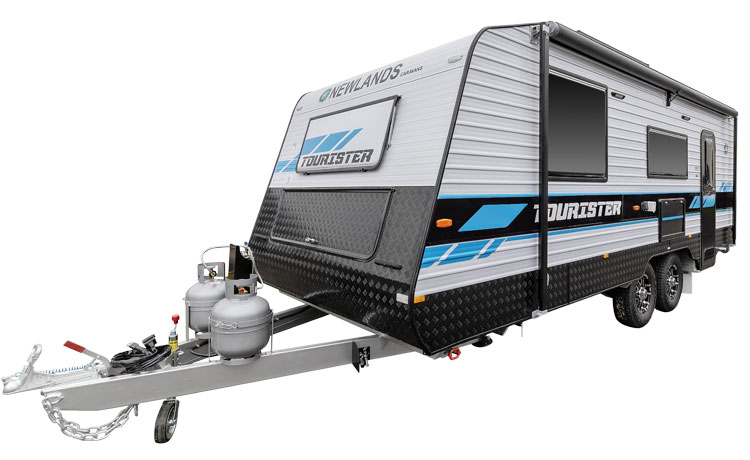 Newlands Tourister Caravan is being parked in the yard