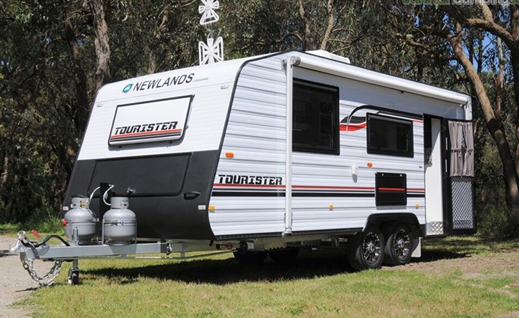 Newlands Tourister Caravan is being parked in the yard